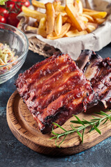 Spicy barbecued pork ribs served with BBQ sauce