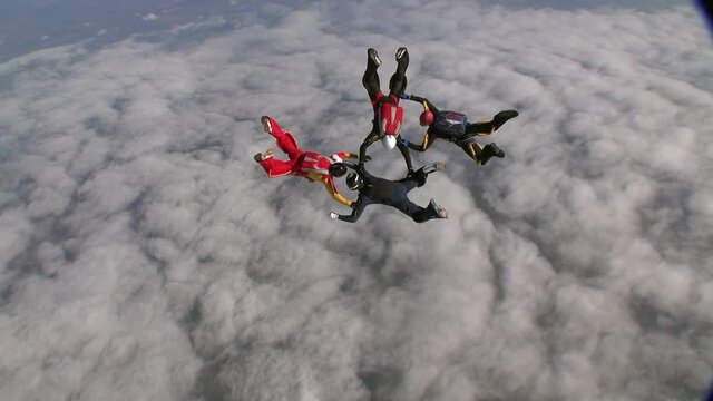 Sports parachutist build a figure in free fall. Extreme sport concept.