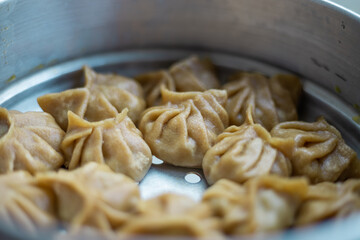 Top view of Chicken Momo Dumplings Dimsum snacks. Delicious homemade food.