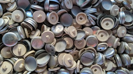 Collection of shirt buttons made of aluminum. Suitable for the concept of clothing.