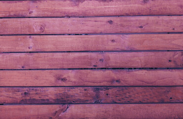 Beautiful background of closeup dark brown wood. Ideal for use in the design or wallpaper