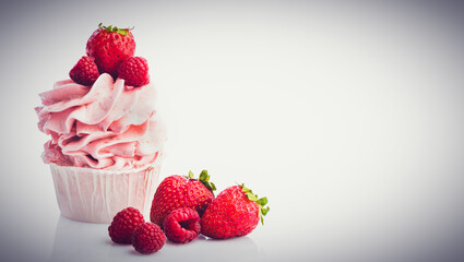 Fruit pink muffin with strawberries and rasperries