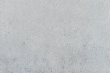 Empty exposed grey concrete wall as vintage background