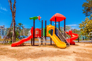 Colorful outdoor modern children playground without children in the play yard