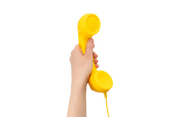 Yellow handset in woman hand isolated on white.