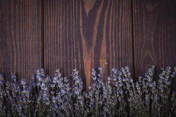 Beautiful floral background with lavender on a vintage wooden table, top view. Rustic or vintage background. Hight quality photo