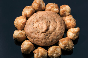 Small sweet cupcake and nuts in icing
