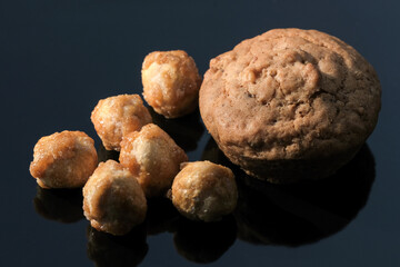 Small sweet cupcake and nuts in icing