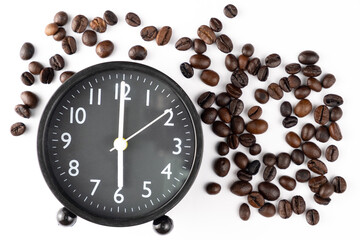 Fototapeta na wymiar clock at 06.00 in the morning. It's time to drink coffee. Object placed on a pile of coffee beans.isolated white background.