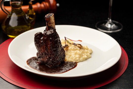 Braised Lamb Shanks, Stinco di agnello vitello brasato with sauce and risotto
