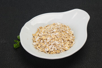 Raw oats in the bowl