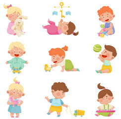Baby Boys and Girls Sitting on the Floor and Playing with Their Toys Vector Set