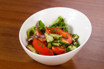 Vegetable salad with tomato, cucumbers
