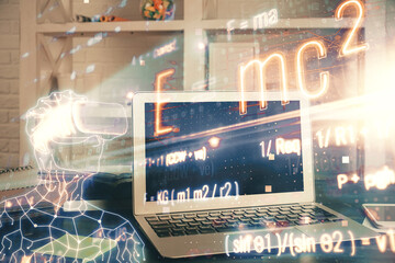 Desktop computer background and formula hologram writing. Double exposure. Education concept.