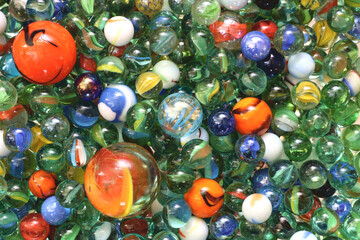 Glass toy marbles of various sizes and colours. 