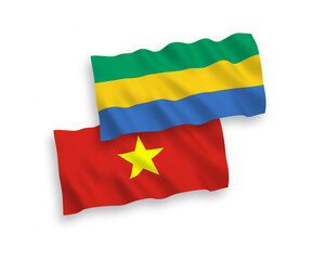 Flags of Gabon and Vietnam on a white background