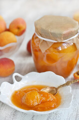 Jam from apricot-slice halves apricot in syrup. light background. Soft focus. Space for text. copy space