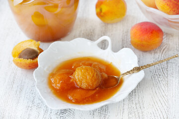 Jam from apricot-slice halves apricot in syrup. light background. Soft focus. Space for text. copy space