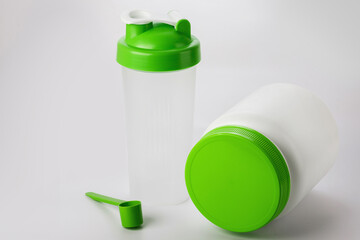 Green protein shaker, scoop and jar