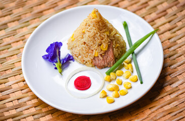 fried rice corn on white plate asian food in thai /
