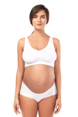 Fototapeta premium Young and beautiful pregnant woman on white background