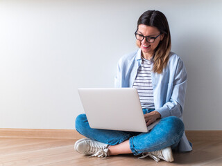 Distance learning online education. Woman studying with laptop, watching webinar