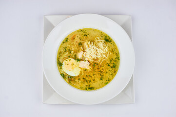soup noodles with egg and herbs on a dark background lake