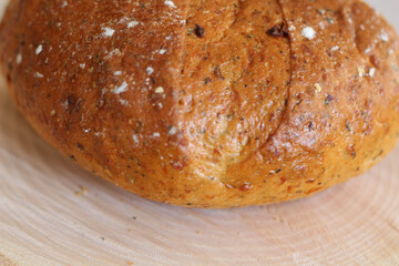 Brown bread on wood stock photo. Home made. Bread on wood block. 