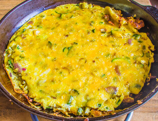 Omelet with eggs, zucchini and cheese