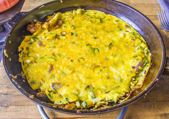 Omelet with eggs, zucchini and cheese