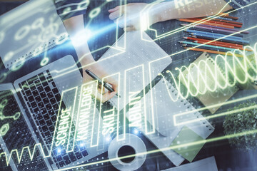 Education theme hologram over woman's hands writing background. Concept of study. Double exposure