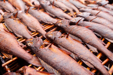 Smoked fish. Smoke. Hot Smoked fish meat. Smoked fish. Perch. Smoked fish background texture.