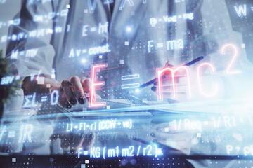 Science formula hologram over woman's hands taking notes background. Concept of study. Double...