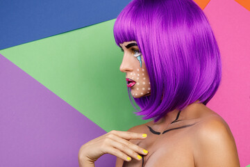 Model in creative image with pop art makeup