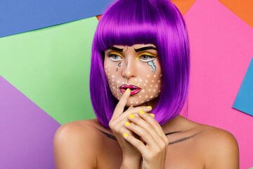 Model in creative image with pop art makeup