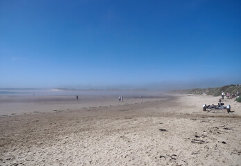 Fototapeta na wymiar Early morning Sea Mist coming off the east coast of Beadnell Bay in Northumberland, in England, UK