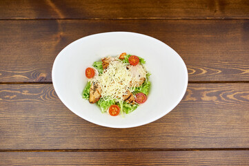 A plate of food sitting on top of a wooden table