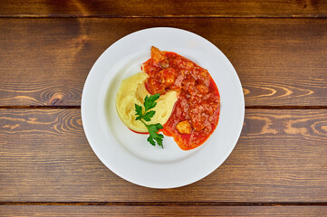 A plate of food on a wooden table