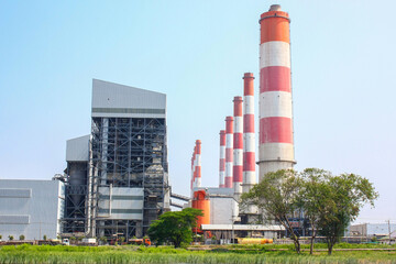 Fototapeta na wymiar Industrial coal power plant with smokestacks and wetland