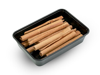 cinnamon sticks in plastic box isolated on white background ,include clipping path
