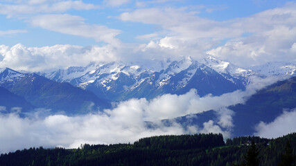 cloudy and sunny morning on the mountains in spring with view to the alps in austria