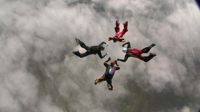 Sports parachutist build a figure in free fall. Extreme sport concept.