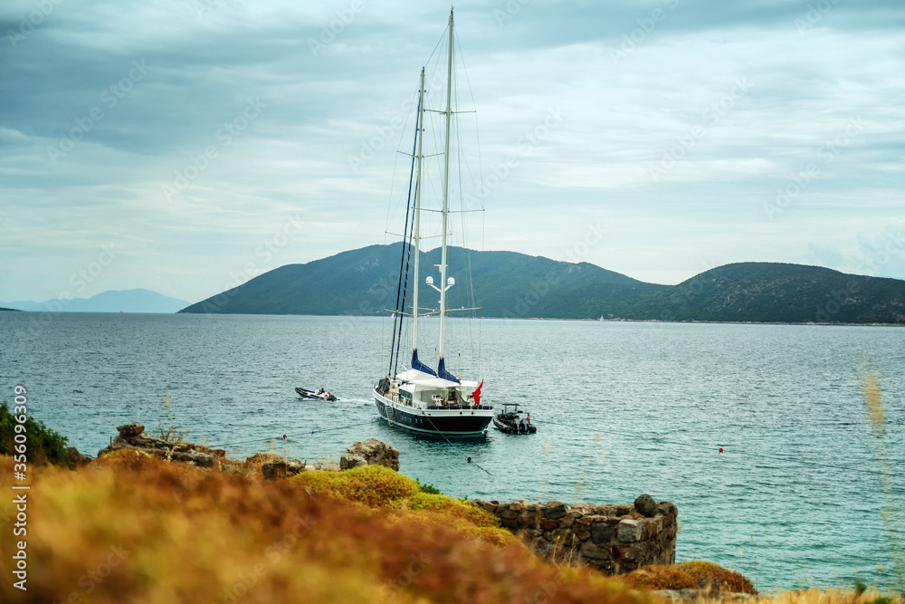 Wall mural Beautiful seascape, a luxury yacht on the sea shore. Retro tone image