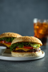Homemade cheeseburgers on a white plate