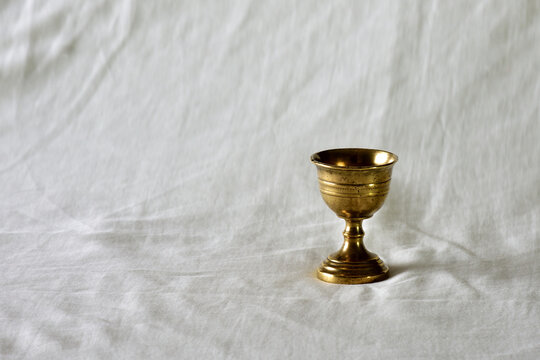 Golden chalice  on cloth background