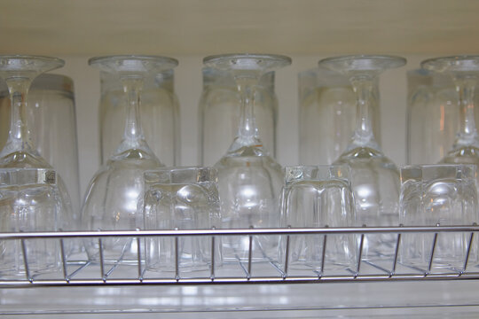 glasses in the kitchen a drawer,clean glasses in the kitchen drying in the furniture