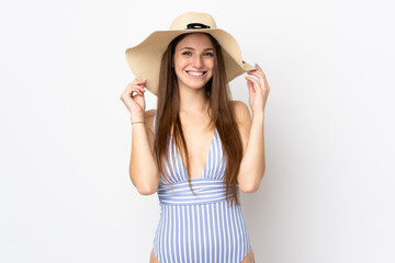 Young caucasian woman isolated on white background happy in swimsuit in summer holidays