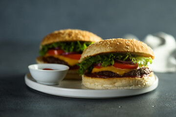 Homemade cheeseburgers on a white plate