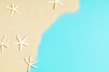Fototapeta na wymiar Summer concept. Starfish on sea sand.Texture light sand. Concept beach holiday. Flat lay, top view, copy space
