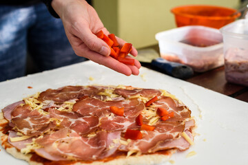 Obraz na płótnie Canvas Making of homemade Italian pizza in fireplace brick oven.